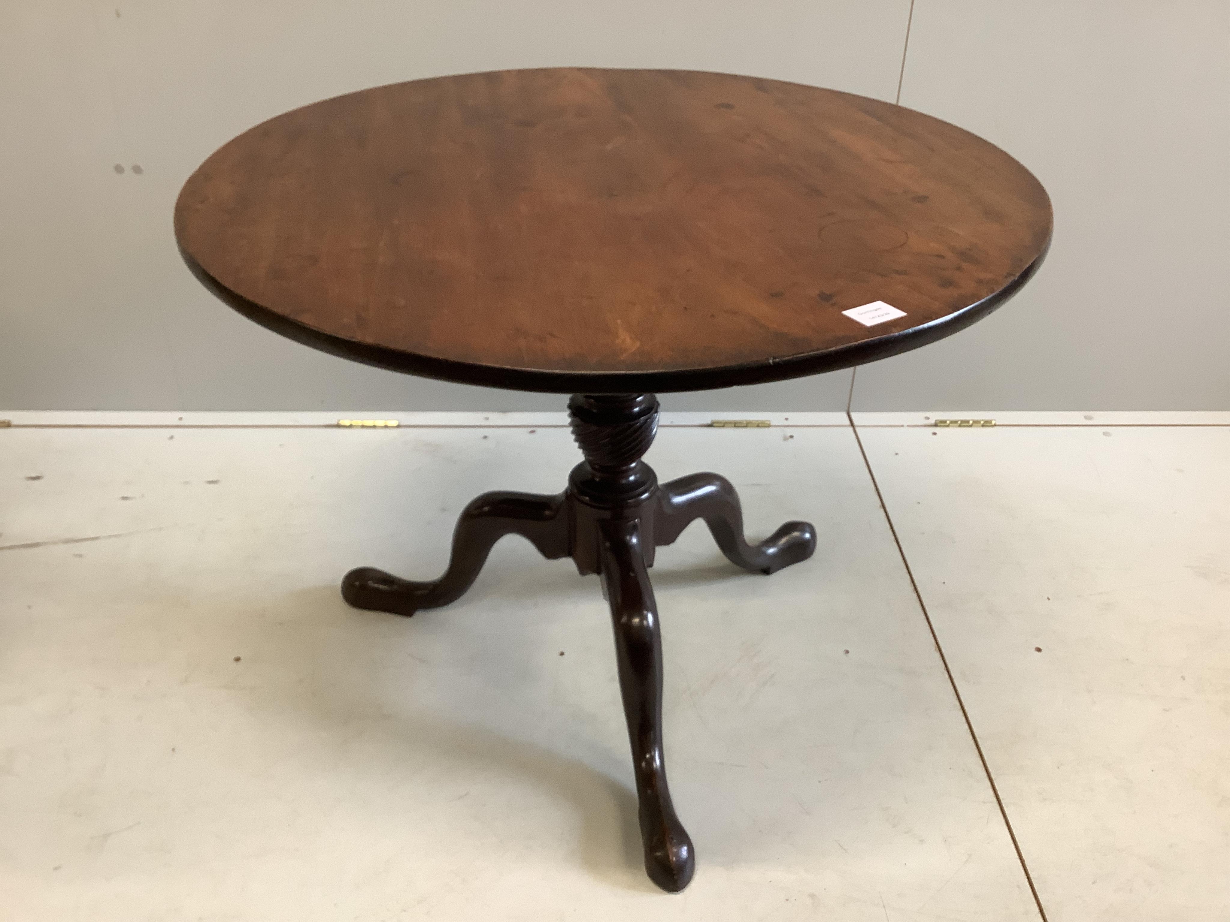 A George III circular mahogany tilt top tripod tea table, diameter 89cm, height 67cm. Condition - fair